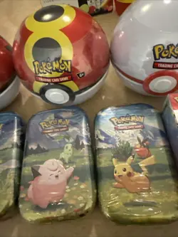 Pokemon TCG Lot W/ Prismatic, 3 Balls, 4 Tins And 1 Double Pack With Pong Coin - Image 3
