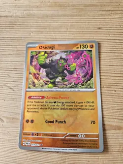 Okidogi 057/131 Pokeball, Prismatic Evolutions, Pokemon, NM - Image 1