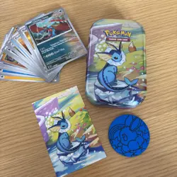 Vaporeon Mini Tin, Card Art & Eevee Coin / Pokemon Prismatic Evolutions/ Bulk - Image 1