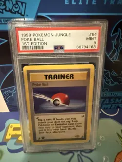 Pokemon 1999 Jungle Poke Ball 1st Edition PSA 9 Trainer Card 64/64 - Image 1
