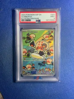 2024 POKEMON SSP EN-SURGING SPARKS ILLUSTRATION RARE #207 CLOBBOPUS PSA 9 - Image 1