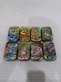 Prismatic Evolutions Full Set of Empty Tins w/ Art Cards & Coins - Image 1