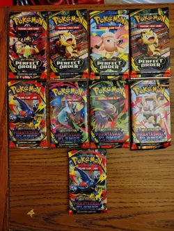 Pokemon Booster Lot Of 9 Packs (Phantasmal Flames/Perfect Order) - Image 1