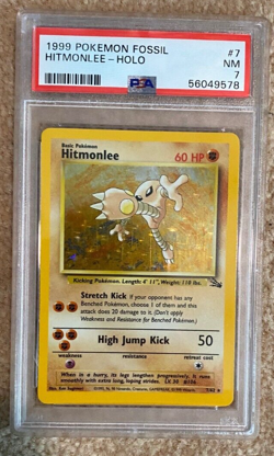 1999 Pokemon Fossil Hitmonlee Holo PSA 7 - Image 1