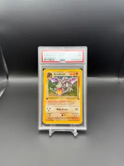 1999 POKEMON FOSSIL 1ST EDITION #1/62 AERODACTYL HOLO RARE PSA 7 - Image 1