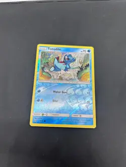 Pokemon - Totodile - 18/73 - Common - Reverse Holo - Sun & Moon Shining Legends - Image 1