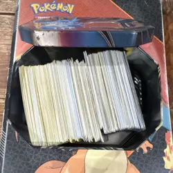 Pokemon TCG Pikachu Mixed Card Lot in Tin with Coins Standard Card Stock - Image 1