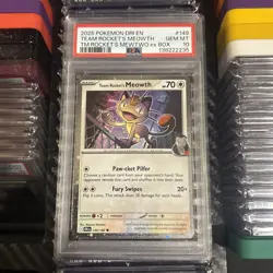 PSA 10 2025 POKEMON TEAM ROCKET'S MEOWTH COSMOS HOLO DRI EN-DESTINED RIVALS #149 - Image 1