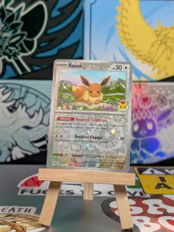 Eevee - 074/131 (Pokemon Day 2025) (Reverse Cosmos Holo) Promo 074/131 Swirl - Image 1