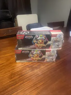 Pokemon PRISMATIC EVOLUTIONS 2 PK- SURPRISE BOX AND BOOSTER BUNDLE - Image 1