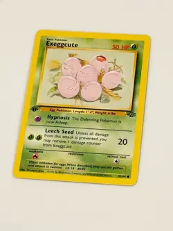 1st Edition Exeggcute Pokemon Card 1999 Jungle Set WOTC 52/64 - Image 1