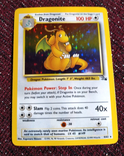 NINTENDO GAME POKEMON DRAGONITE FOSSIL 4 HOLO UNLIMITED NAKED CARD IN PLASTIC PA - Image 1