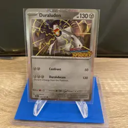 Duraludon 129/191 SURGING SPARKS STAMPED COSMOS HOLO PROMO Pokemon English Stamp - Image 1