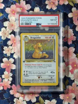 1999 POKEMON FOSSIL 1ST EDITION DRAGONITE-HOLO #4 PSA 8 - Image 1