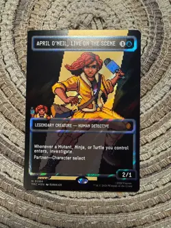 APRIL O'NEIL, LIVE ON THE SCENE PIXEL SURGE FOIL [Borderless] - Mythic - TMC MTG - Image 1