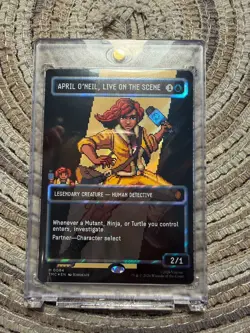 APRIL O'NEIL, LIVE ON THE SCENE PIXEL SURGE FOIL [Borderless] - Mythic - TMC MTG - Image 2