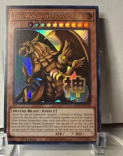 YuGiOh! The Winged Dragon of Ra RA05-EN130 STAMPED ART Rarity 5, ultra rare - Image 1