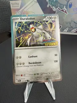 Duraludon 129/191 Surging Sparks Cosmos Holo NM Pokemon Card - Image 1