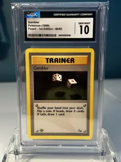 1999 POKEMON FOSSIL 1ST ED #60/62 GAMBLER CGC 10 GEM MINT - Image 1