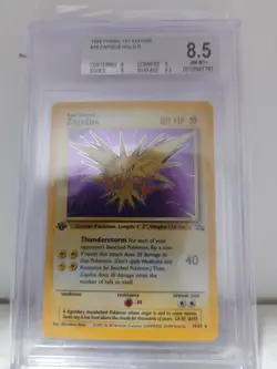Pokemon Fossil 1st Edition ERROR Zapdos Holo Rare BGS 8.5 - Image 1