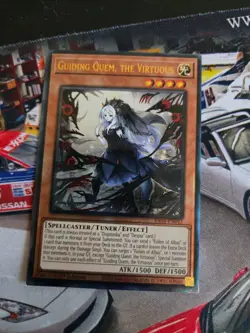 Yu-GI-Oh! Guiding Quem, the Virtuous (PUR) RA04-EN043 Quarter Century Stampede - Image 1