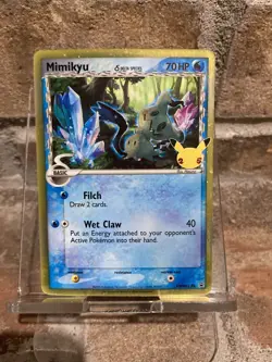 Pokemon TCG Card Celebrations Mimikyu Delta Species SWSH136 Black Star Promo NM - Image 1
