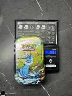 (VERY HEAVY)🔥 107.01g Pokemon Prismatic Evolutions Mini Tin Brand New Sealed - Image 1