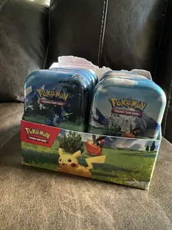Pokemon Trading Card Game Collectible Tins Pikachu with their bulk cards. - Image 1