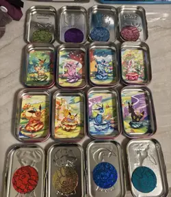 Prismatic Evolutions *EMPTY* Mini Tin Complete Set Of 8 (Tin + Card + Coin) - Image 1