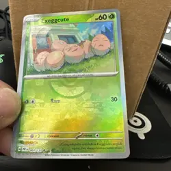 ERROR Pokemon Prismatic Evolutions Exeggcute Poke Ball Texture Shift 001/131 - Image 1