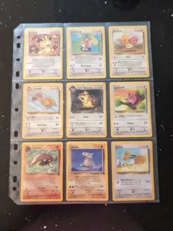 Lot Of 9 Pokemon Cards In Binder Sheet - Image 1