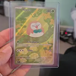 Pokemon Rowlet 090/088 POR Holo Foil TCG Card - Image 1