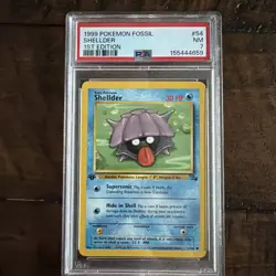 1999 POKEMON FOSSIL 1ST ED #54 SHELLDER PSA 7 - Image 1