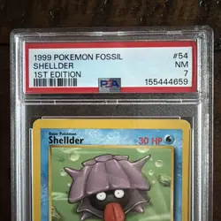 1999 POKEMON FOSSIL 1ST ED #54 SHELLDER PSA 7 - Image 2