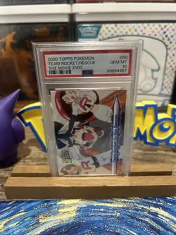 2000 TOPPS POKEMON THE MOVIE 2000 #50 TEAM ROCKET TO THE RESCUE PSA 10 - Image 1