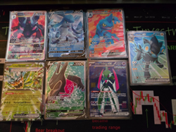 Up for sale is a Lot of 7 Pokemon Ultra Rare Cards (V, VSTAR, and ex). - Image 1