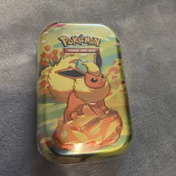 Pokemon Prismatic Evolutions SV8.5 Flareon Mini Tin Factory Sealed 🌟✨🌙💫 - Image 1