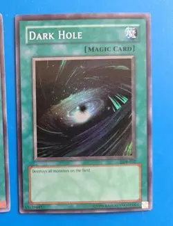 Lightly Played Yugioh Dark Hole - LOB-052 - Super Rare Unlimited - Image 1