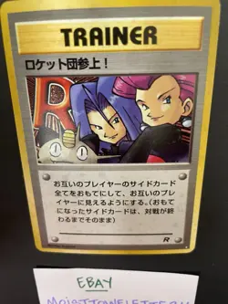 1997 Pokemon TCG Here Comes Team Rocket Holo Trainer - Image 1