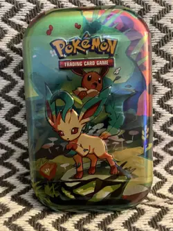 Pokemon TCG: Scarlet & Violet-Prismatic Evolutions Mini Tin | Leafeon I In Hand - Image 1