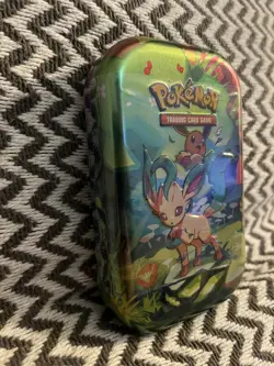 Pokemon TCG: Scarlet & Violet-Prismatic Evolutions Mini Tin | Leafeon I In Hand - Image 2