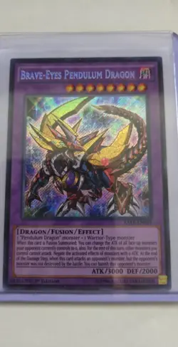 YuGiOh! - Brave-Eyes Pendulum Dragon - RATE-EN039 - Secret Rare - 1st - NM - Image 1