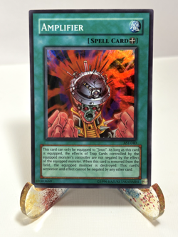 YuGiOh! Amplifier AST-040 Unlimited Super Rare LP - Image 1