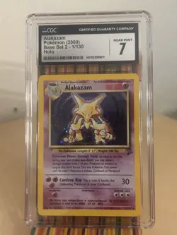1999 Alakazam Pokemon Base Set 2 1/130 Unlimited Holo Rare CGC 7 * SWIRL - Image 1