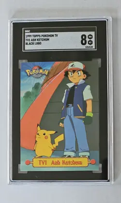 1999 Topps Pokemon TV1 #TV1 Ash Ketchum & Pikachu Black Logo SGC 8 - MT-NM - Image 1