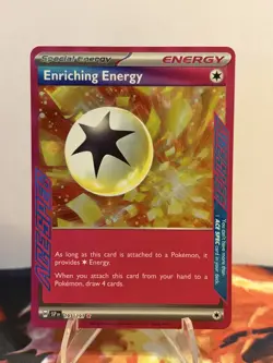 Pokemon TCG Enriching Energy 191/191 Sv08: Surging Sparks ACE SPEC Rare Holo - Image 1