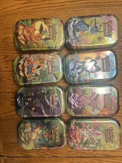 Pokemon TCG: Scarlet & Violet Prismatic Evolutions Mini Tin Display Box (8 Tins) - Image 2