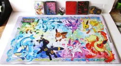 Pokemon TCG Super Prismatic Evolutions Play Mat/Card Sleeves/Figure - Image 1
