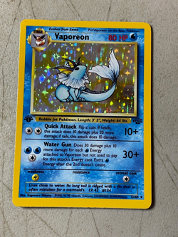 First Edition Vaporeon 12 /64 Pokemon Base Set 1st Edition Holofoil MP/HP Card - Image 1