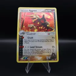 Team Magma's Aggron 7/95 Team Magma vs Team Aqua Holo English Pokemon SWIRL MP - Image 1